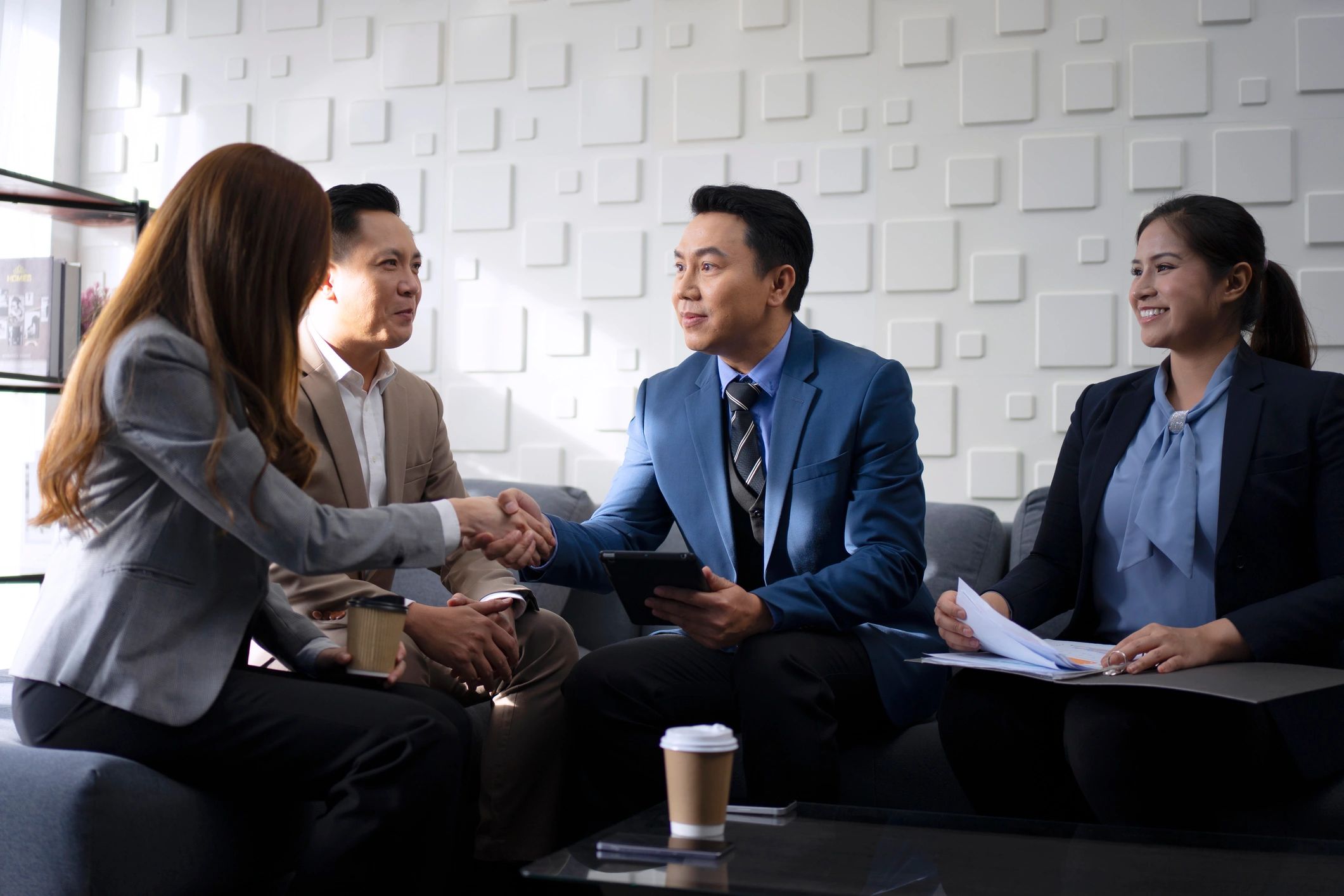 Office team discussing supplier payment and trade planning